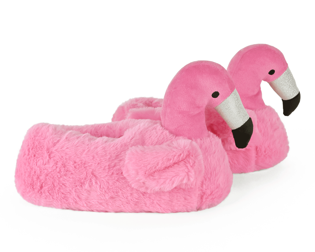 Pink flamingo-shaped slippers seen from the side on a white background