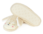 Pair of beige bunny slippers with long ears and embroidered faces on a white background, one slipper is turned upside down to show the non-slip sole