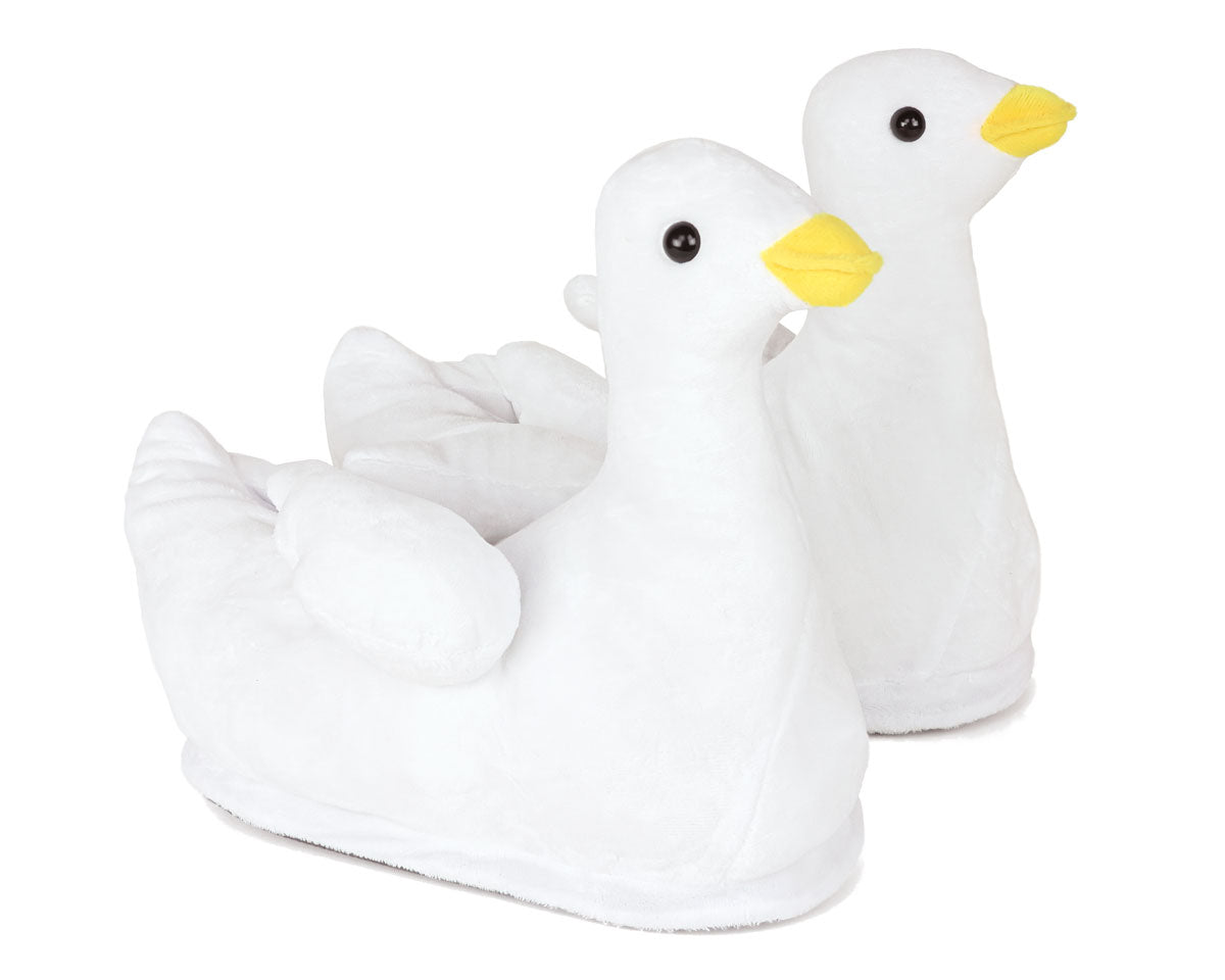 White duck-shaped slippers with yellow beaks on a white background