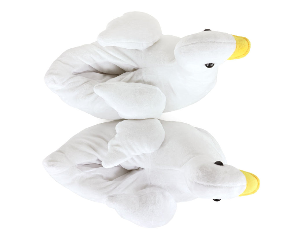 Two white plush goose slippers seen from above